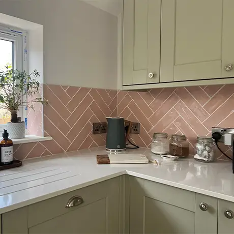 Kitchen with Poitiers Rose Pink splashback and sage cabinetry